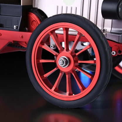 The Curious Mind Vintage Classic Car DIY Kit: detailed metal model with red spoked wheels and black tires.