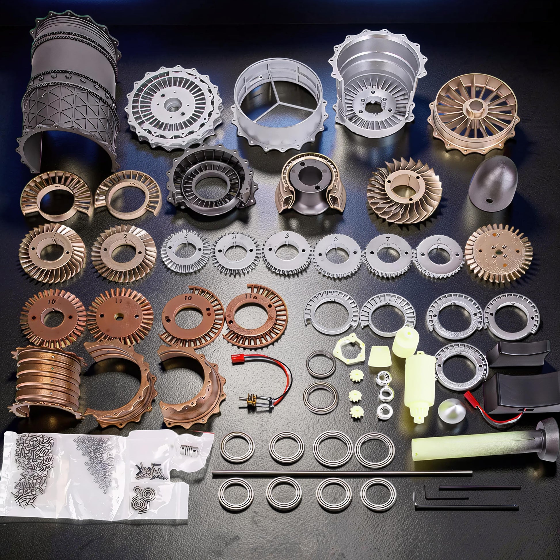 The Curious Mind WS-15 Fighter Turbofan DIY Kit with PLA parts, including fan blades, casings, screws, and assembly tools.