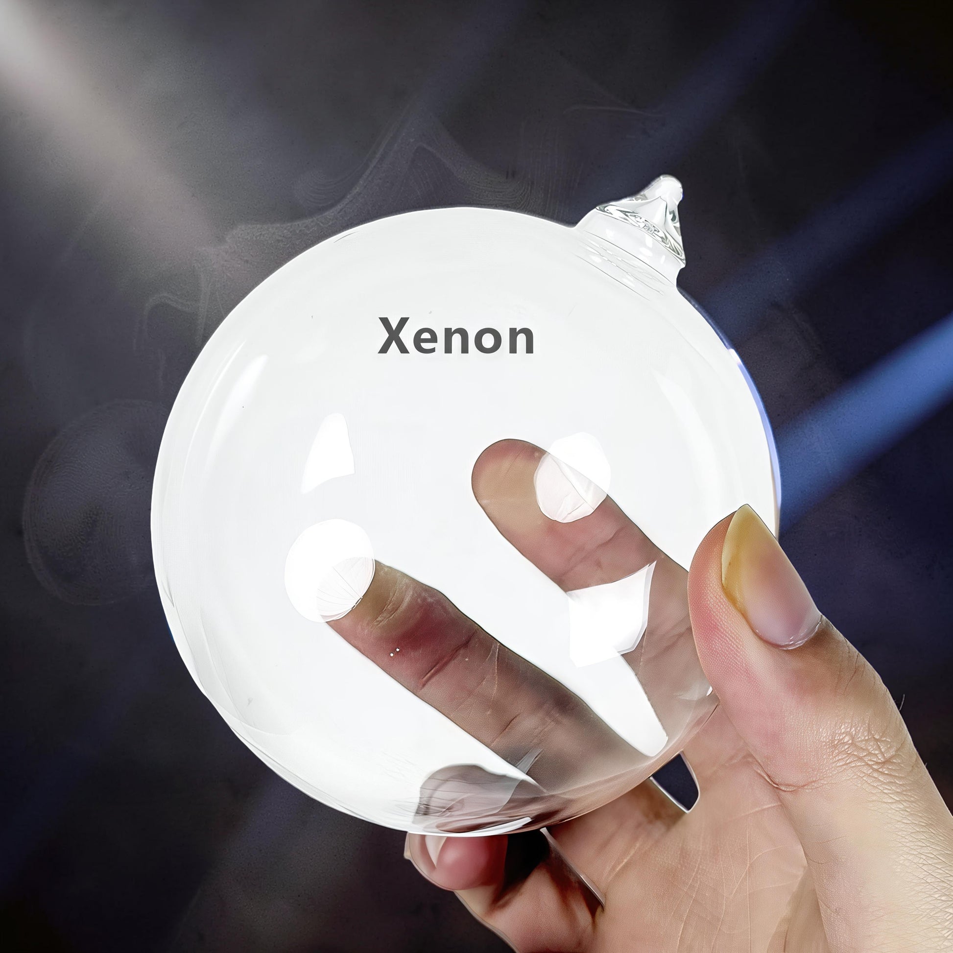 The Curious Mind Xenon Ion Ring Glass Sphere interactive science display with a hand touching the glass.
