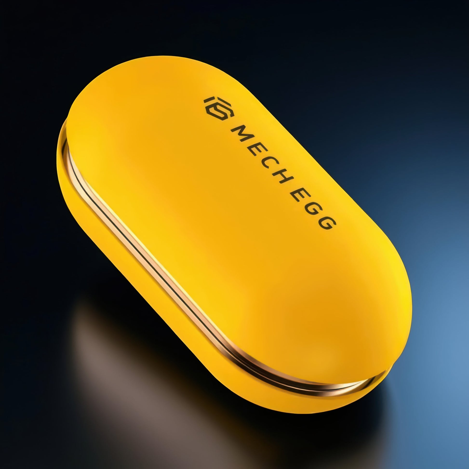 The Curious Mind Mech Egg Clicker Slider, a compact yellow metal fidget toy with a smooth, rounded capsule shape and a clicky slider action.
